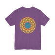 A close-up image of a white t-shirt featuring a vibrant mandala design, symbolizing peace and harmony through its intricate patterns and colorful hues