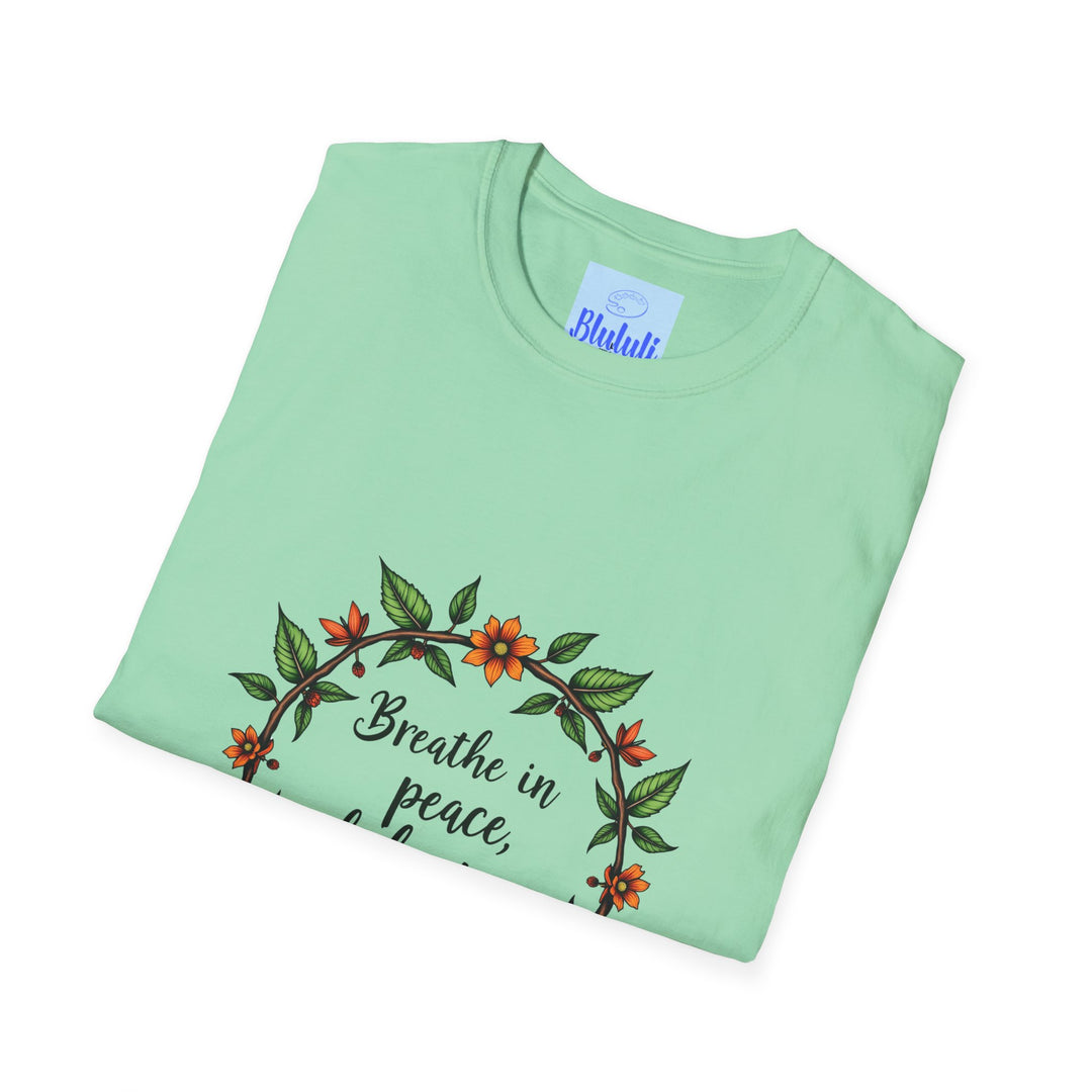 Beautiful white t-shirt with a floral garland design and the text 'Breathe in Peace Exhale Stress' printed on it, symbolizing relaxation and tranquility