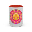 Mug with pink, yellow, and green mandala art on white background