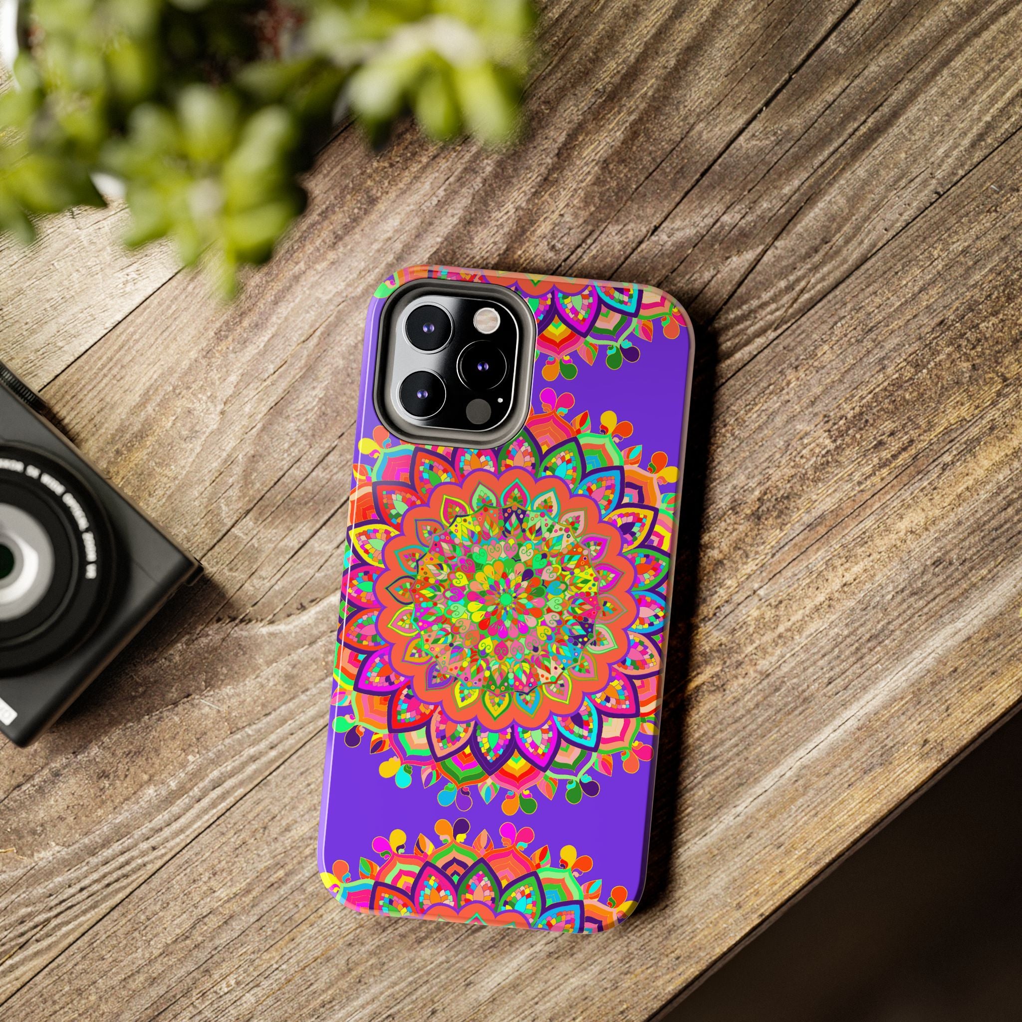 Phone case featuring a hand-drawn purple mandala art design for stylish protection