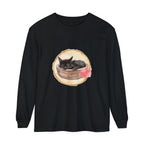 A watercolor illustration of a peaceful sleeping cat nestled in a bowl on a long sleeve t-shirt