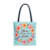 A beautiful floral tote bag with the quote Bloom Where You Are Planted available in 3 sizes