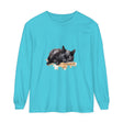 A watercolor illustration of a sleeping black cat on a t-shirt