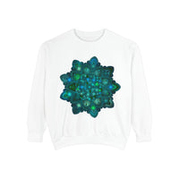 A close-up image of the intricate blue and green mandala design on a sweatshirt, featuring detailed patterns and vibrant colors