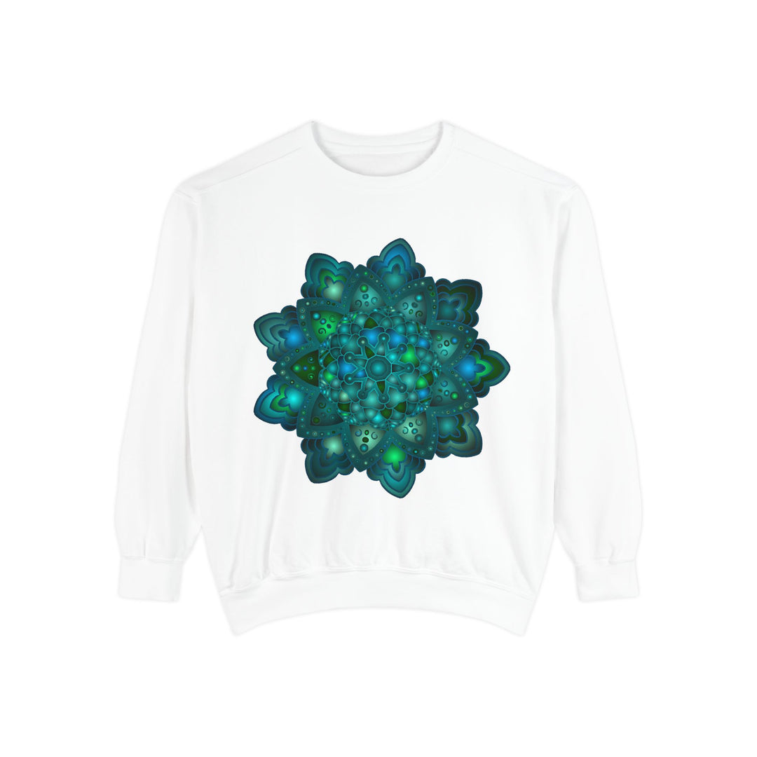 A close-up image of the intricate blue and green mandala design on a sweatshirt, featuring detailed patterns and vibrant colors