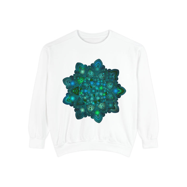 A close-up image of the intricate blue and green mandala design on a sweatshirt, featuring detailed patterns and vibrant colors