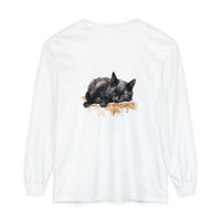 A detailed watercolor illustration of a black cat sleeping on a t-shirt