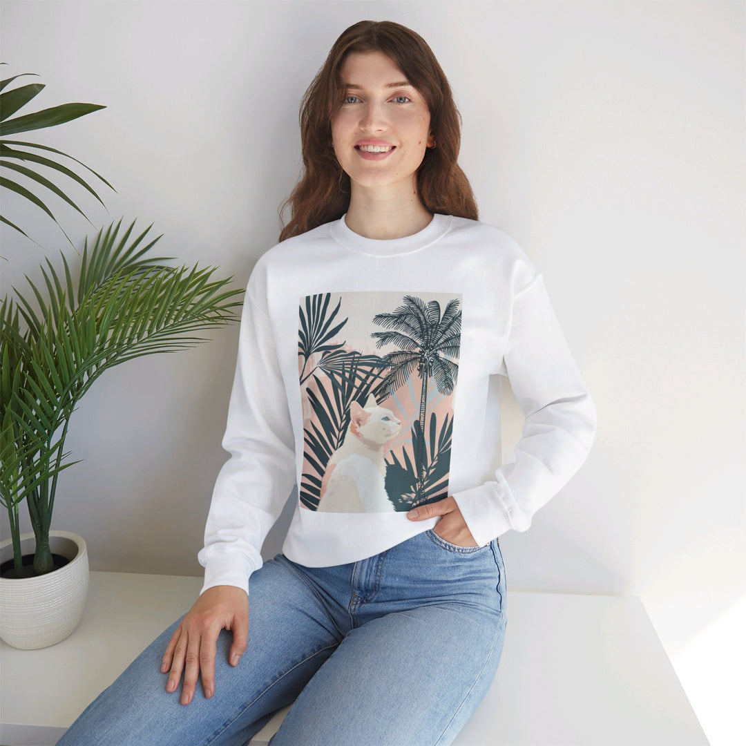 A cozy unisex heavy blend crewneck sweatshirt featuring a cat under palm trees design