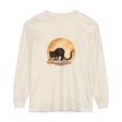 Black cat with arched back and glowing yellow eyes against full moon on Halloween-themed t-shirt