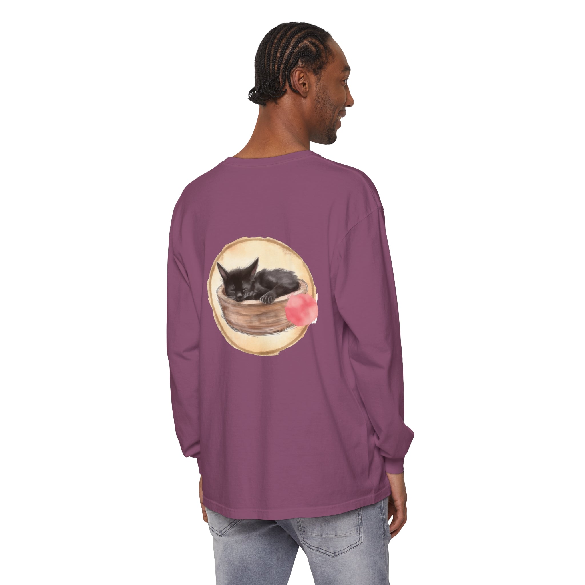 A watercolor illustration of a sleeping cat in a bowl on a long sleeve t-shirt