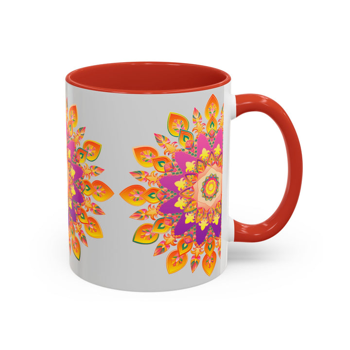 A close-up photo of a white ceramic mug with a colorful mandala-style floral design on it