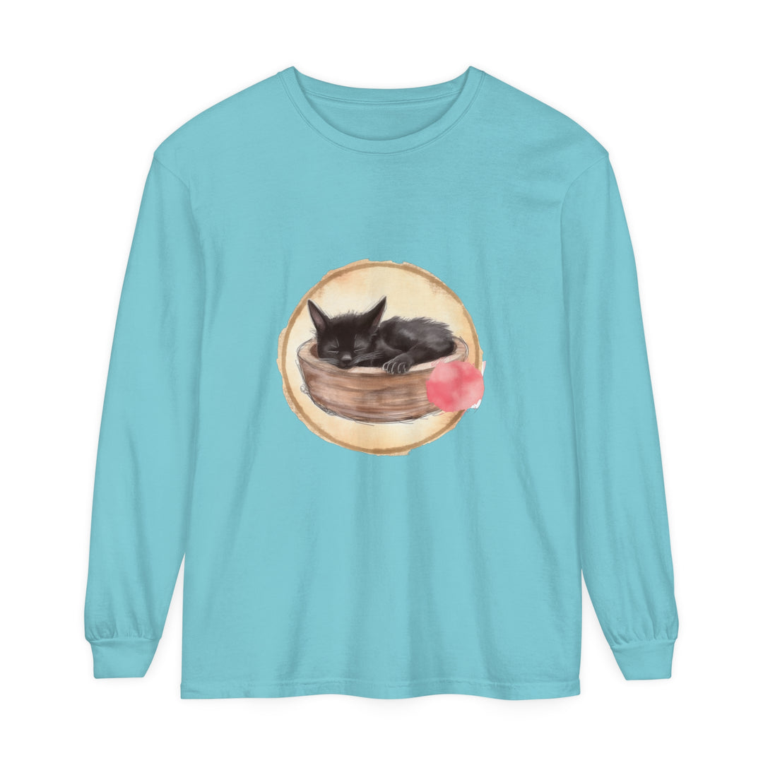 A watercolor illustration of a sleeping cat curled up in a bowl on a long sleeve t-shirt