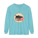 A watercolor illustration of a sleeping cat curled up in a bowl on a long sleeve t-shirt