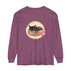 A long sleeve t-shirt featuring a watercolor illustration of a sleeping cat in a bowl