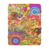 Colorful psychedelic sherpa blanket on a white background