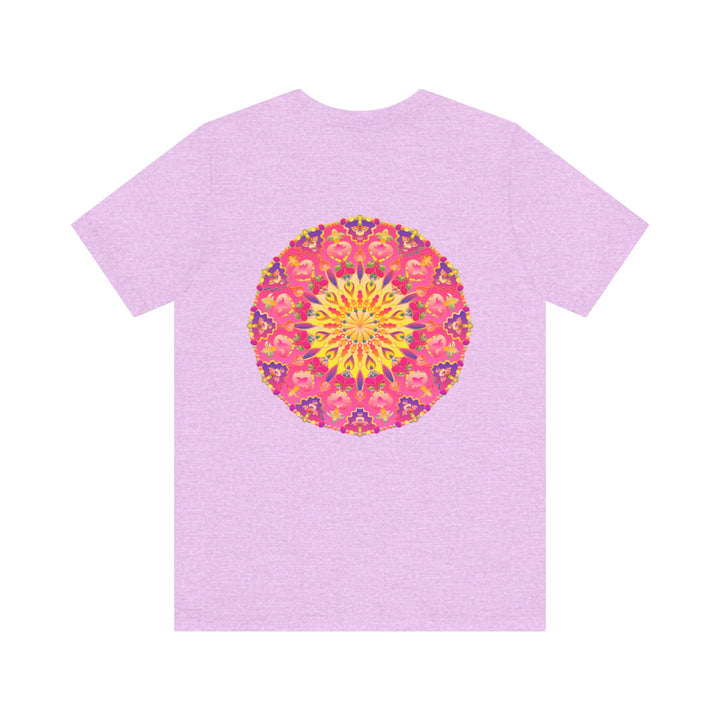 A vibrant pink and yellow mandala design adorns this T-shirt, symbolizing peace and harmony