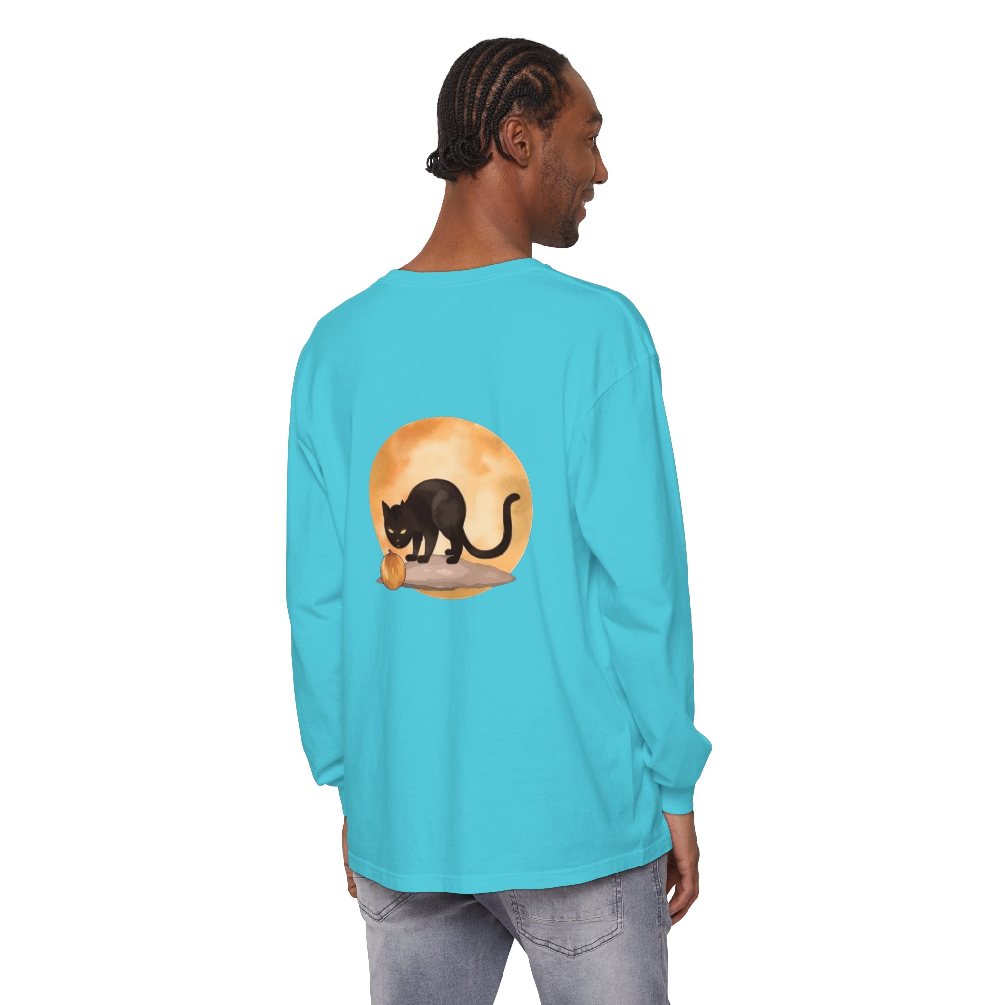 A spooky black cat with glowing yellow eyes and a full moon in the background, featured on a Halloween-themed t-shirt