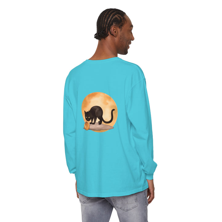 A spooky black cat with glowing yellow eyes and a full moon in the background, featured on a Halloween-themed t-shirt