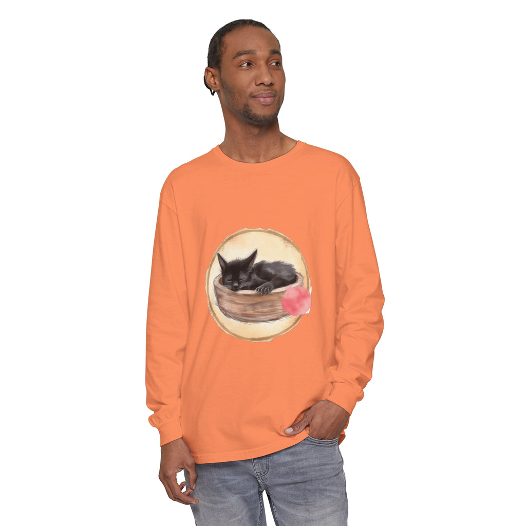 A watercolor illustration of a sleeping cat in a bowl, featured on a long sleeve t-shirt