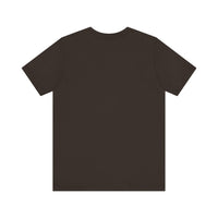 A close-up image of a black t-shirt with vibrant paint splatter design, featuring a mysterious black cat motif