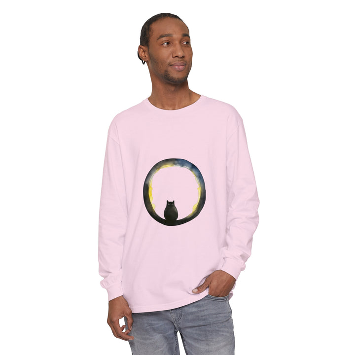 A black cat sitting in front of a crescent moon on a Halloween-themed t-shirt