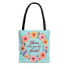 Large, medium, and small floral tote bags with 'Bloom Where You Are Planted' design