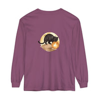 A black cat sits under a crescent moon on a night sky t-shirt