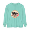 A watercolor illustration of a cute sleeping cat in a bowl, printed on a long sleeve t-shirt