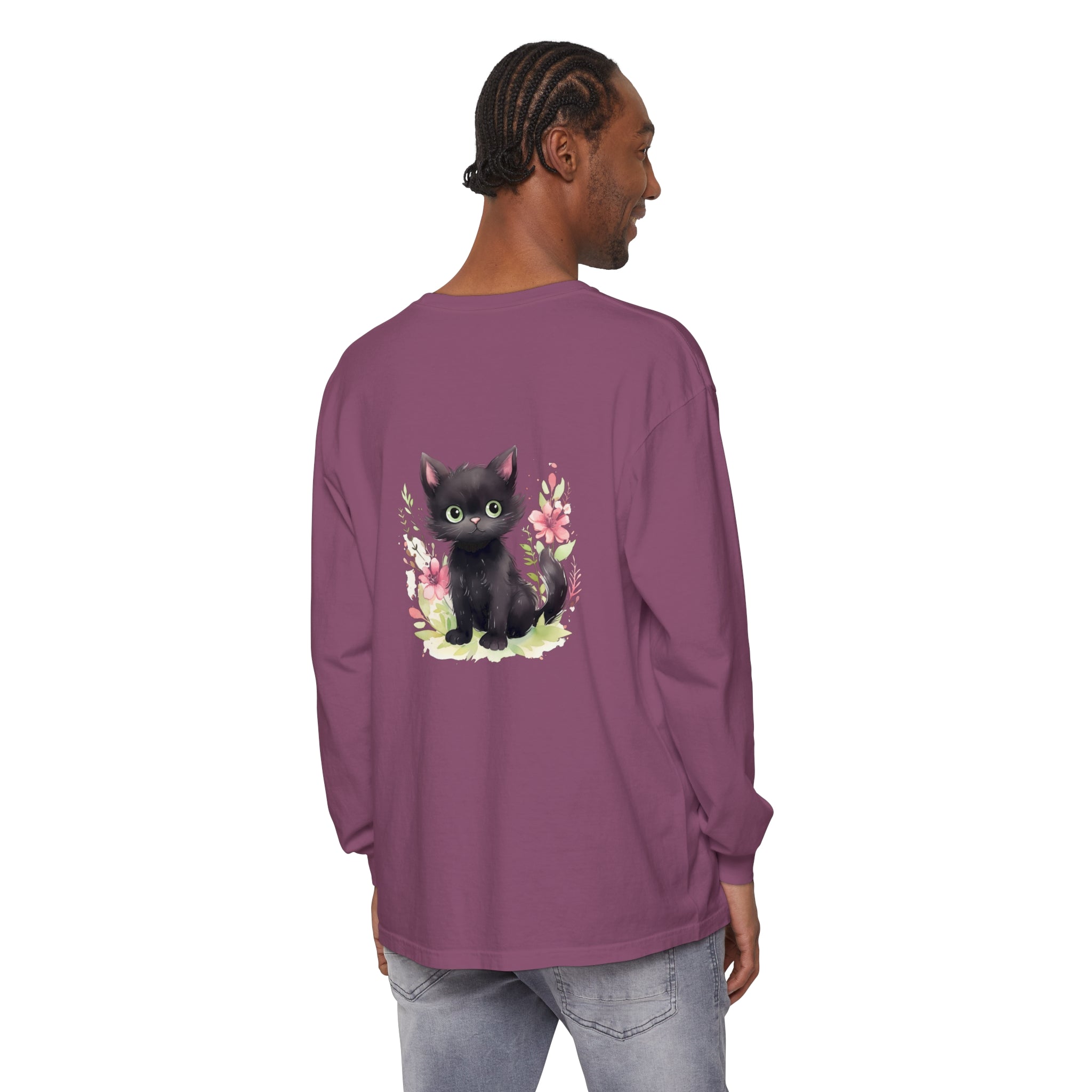 A colorful watercolor illustration of a playful kitten surrounded by vibrant floral designs on a comfortable t-shirt