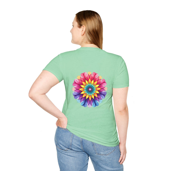 A close-up image of a white t-shirt with a colorful floral mandala design and a quote printed on it