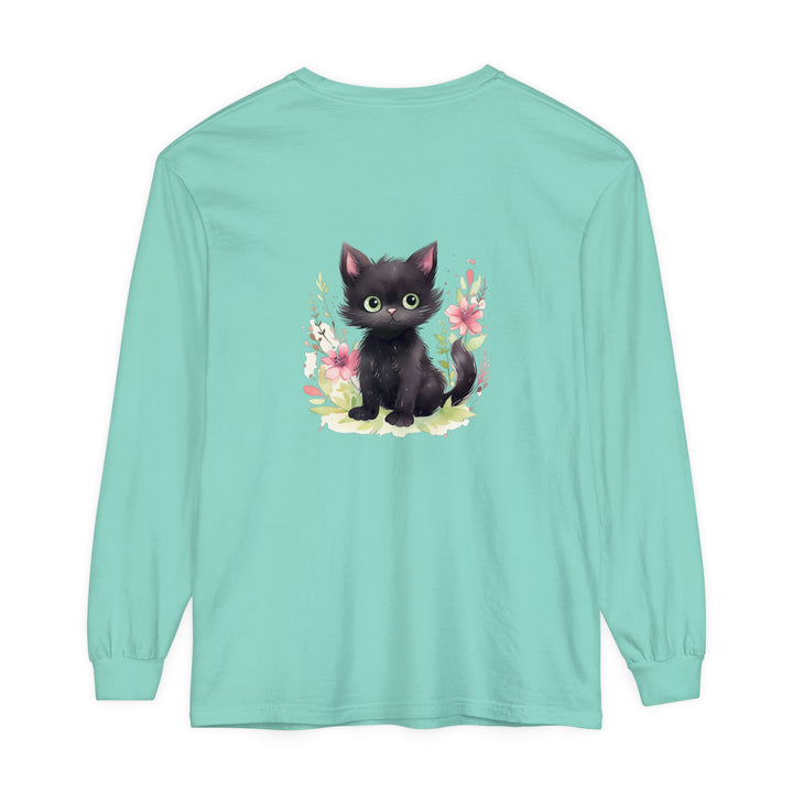 A cute and playful kitten surrounded by colorful floral watercolor designs on a t-shirt