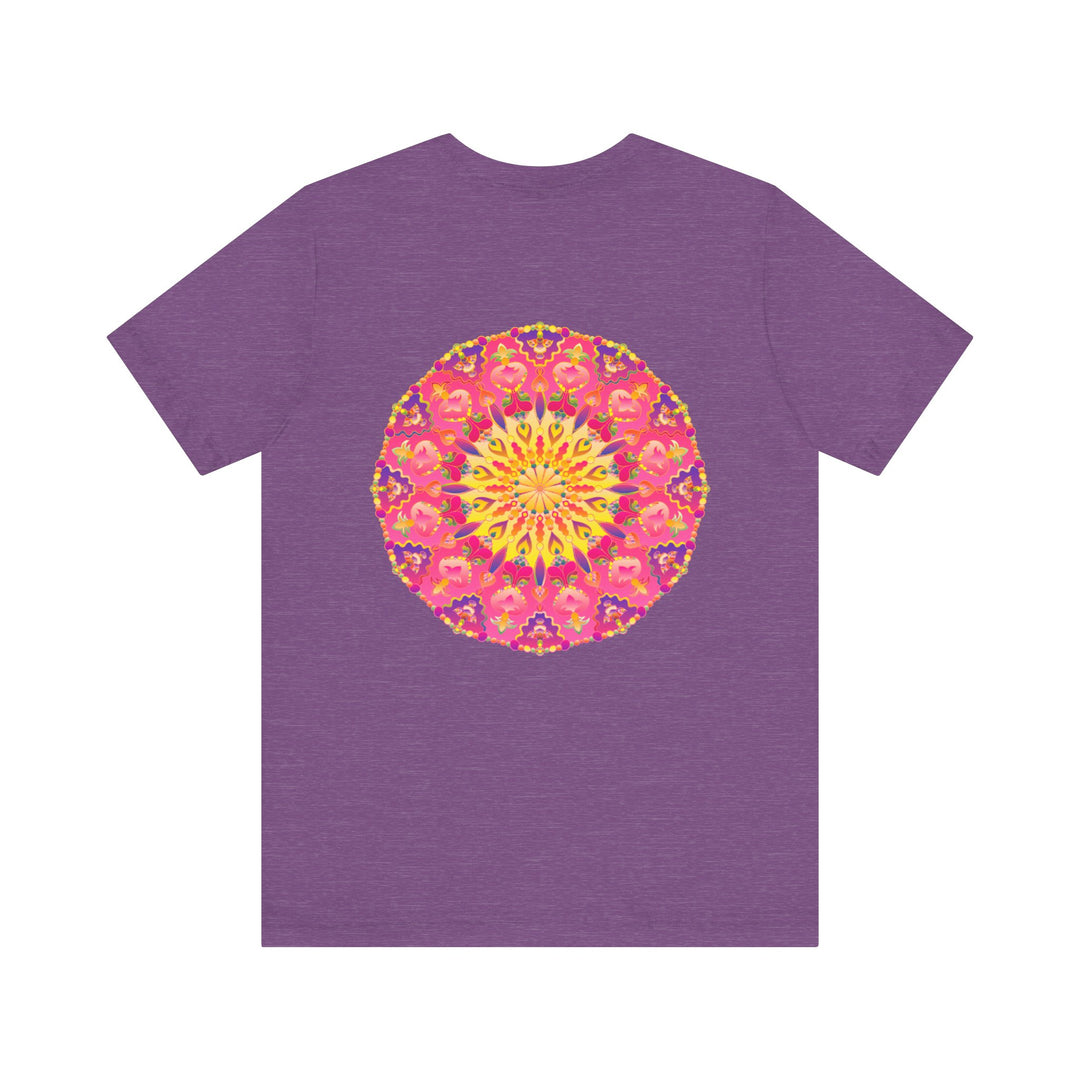 A vibrant and colorful pink and yellow mandala T-shirt featuring a design that represents peace and harmony