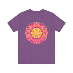 A vibrant and colorful pink and yellow mandala T-shirt featuring a design that represents peace and harmony
