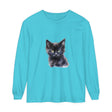 A close up image of a black unisex long sleeve t-shirt with a mystical kitten design on the front