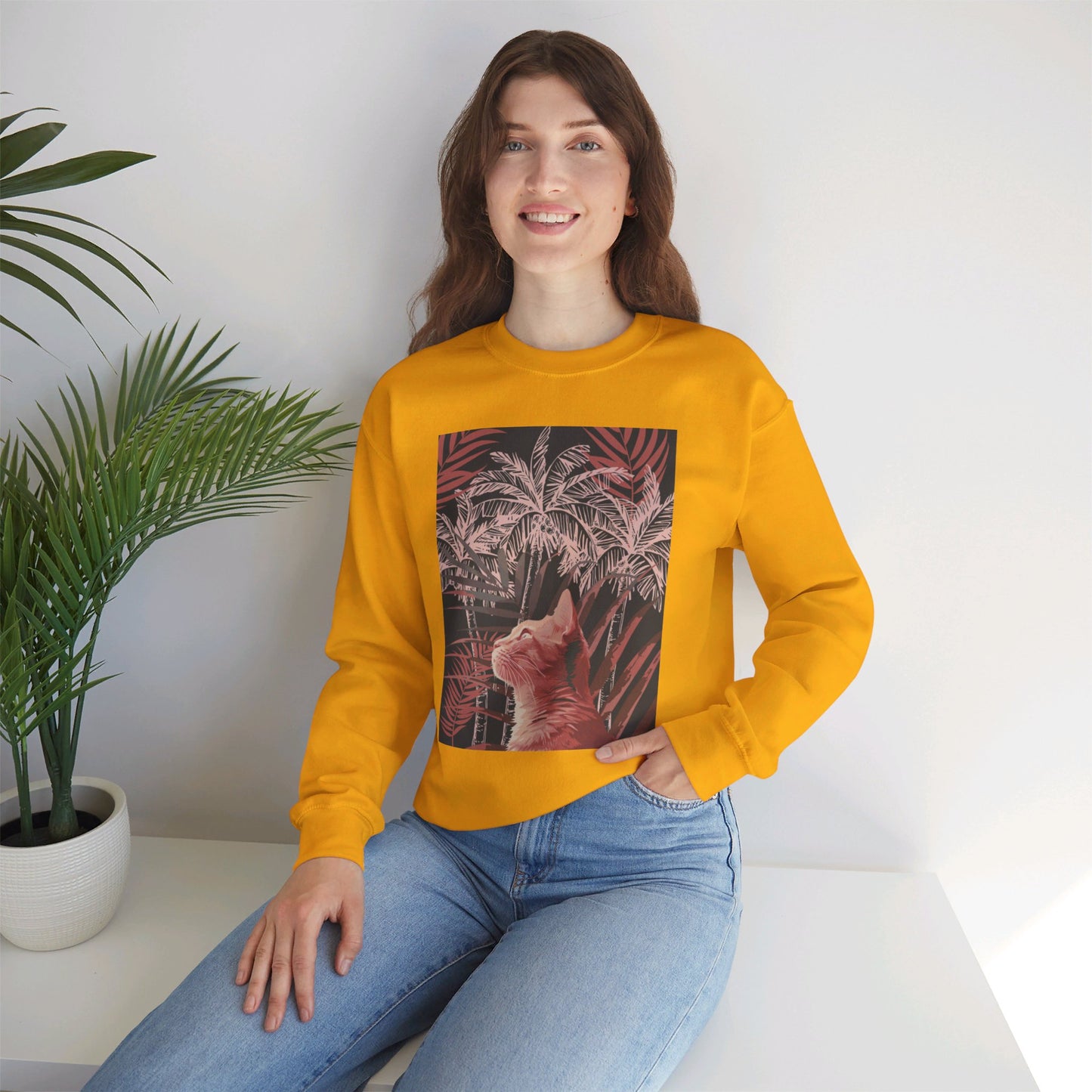 A cozy unisex heavy blend crewneck sweatshirt featuring a cat lounging under palm trees