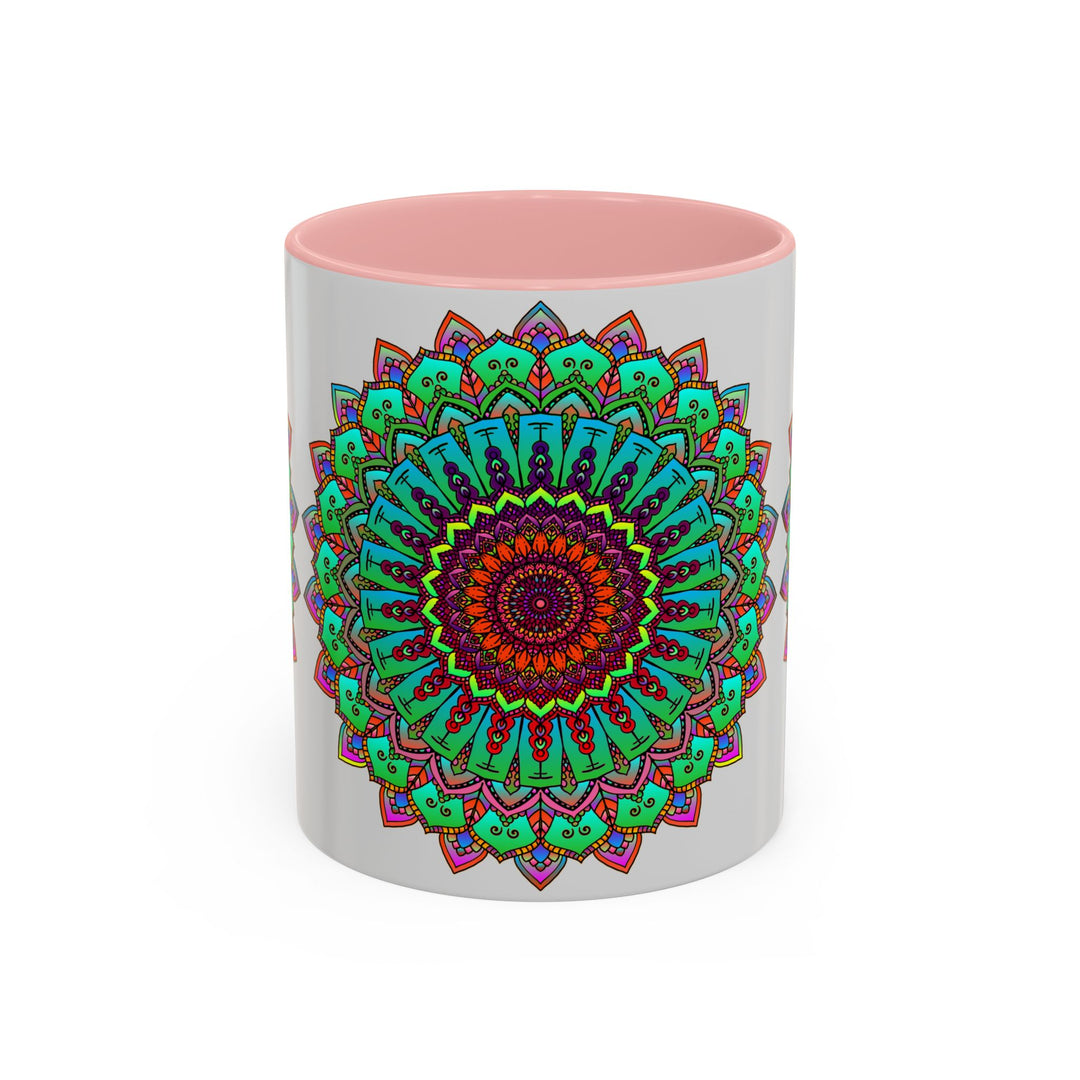 A light grey ceramic mug with a colorful mandala art design