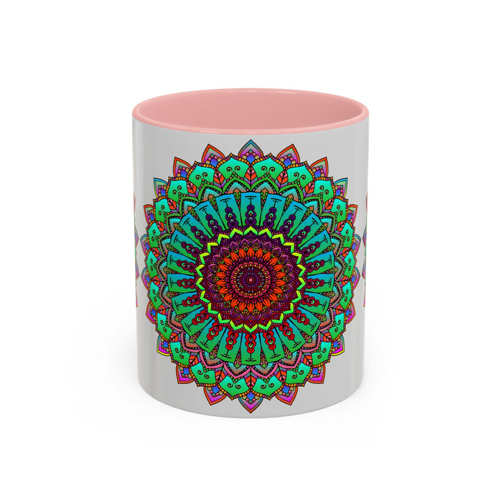 A light grey ceramic mug with a colorful mandala art design