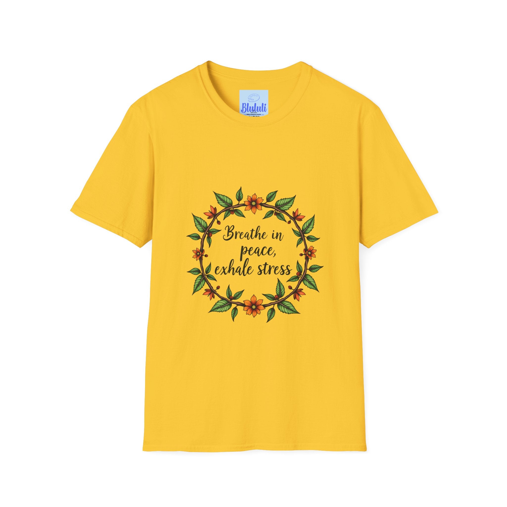 A close-up image of a white t-shirt with a colorful floral garland design and the text Breathe in Peace Exhale Stress printed in a cursive font