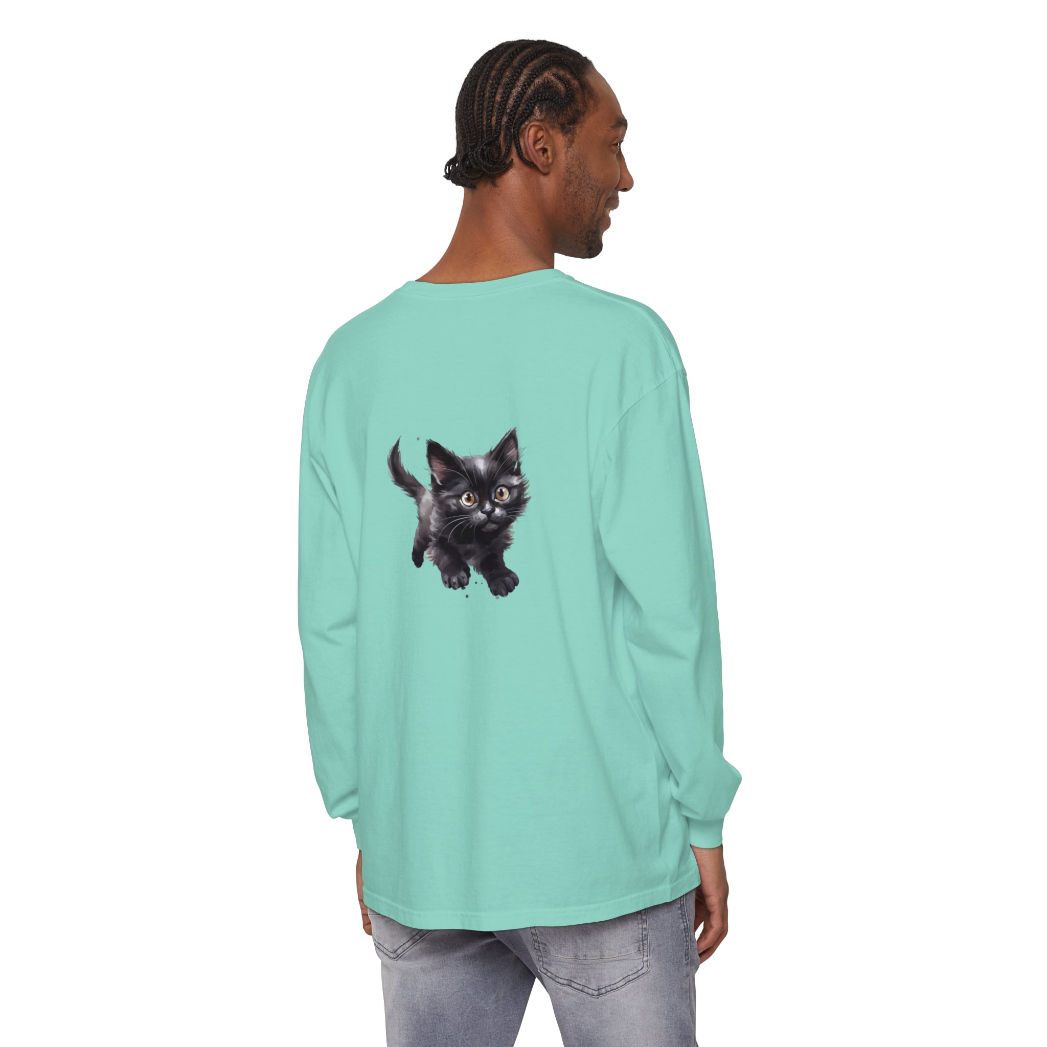 A watercolor illustration of a playful kitten on a colorful t-shirt