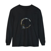 Black cat with golden eyes sitting on a crescent moon on a t-shirt
