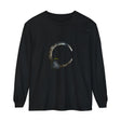 Black cat with golden eyes sitting on a crescent moon on a t-shirt