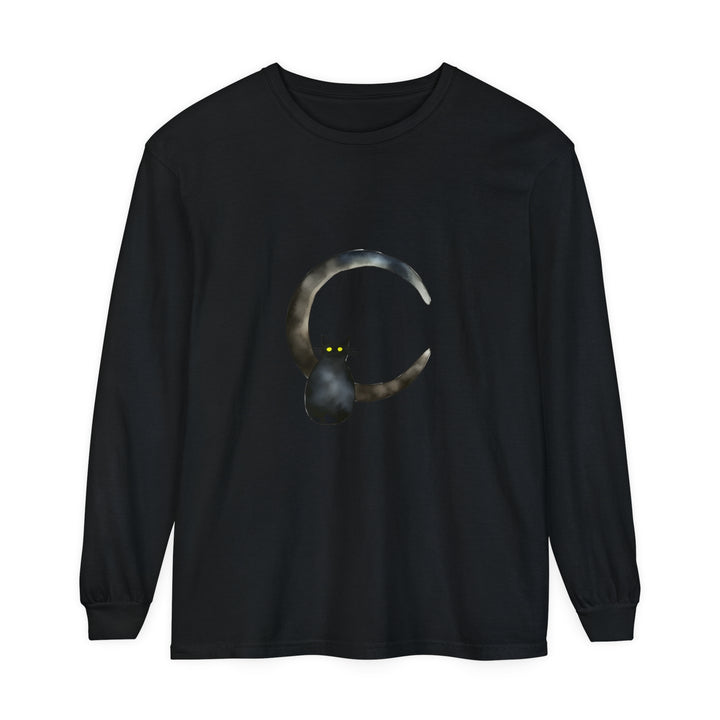 Black cat with golden eyes sitting on a crescent moon on a t-shirt