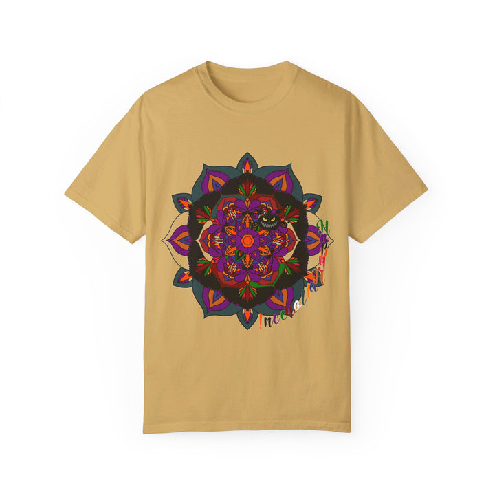 A close-up image of a unisex Halloween Mandala T-shirt featuring a handmade pumpkin mandala art design, on a garment-dyed tee