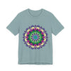 A close-up image of a vibrant mandala tee featuring a colorful and intricate design with bold patterns and beautiful details in various shades of red, blue, yellow, and green