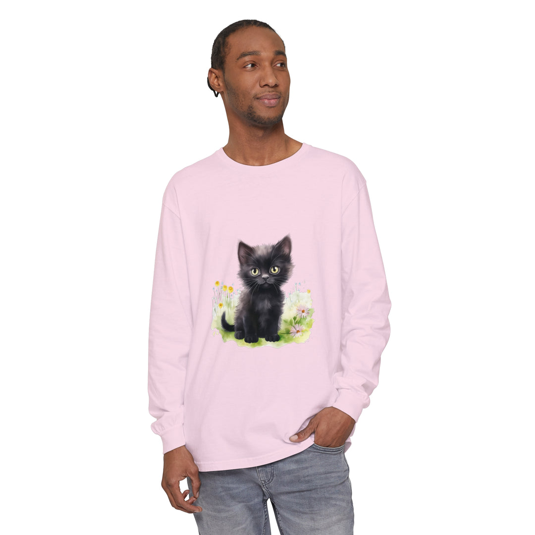 A cute black kitten wearing a flower crown in a lush garden, featured on a long sleeve t-shirt