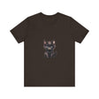 A fluffy grey and white kitten with bright blue eyes wearing a playful and adorable t-shirt with a cute design