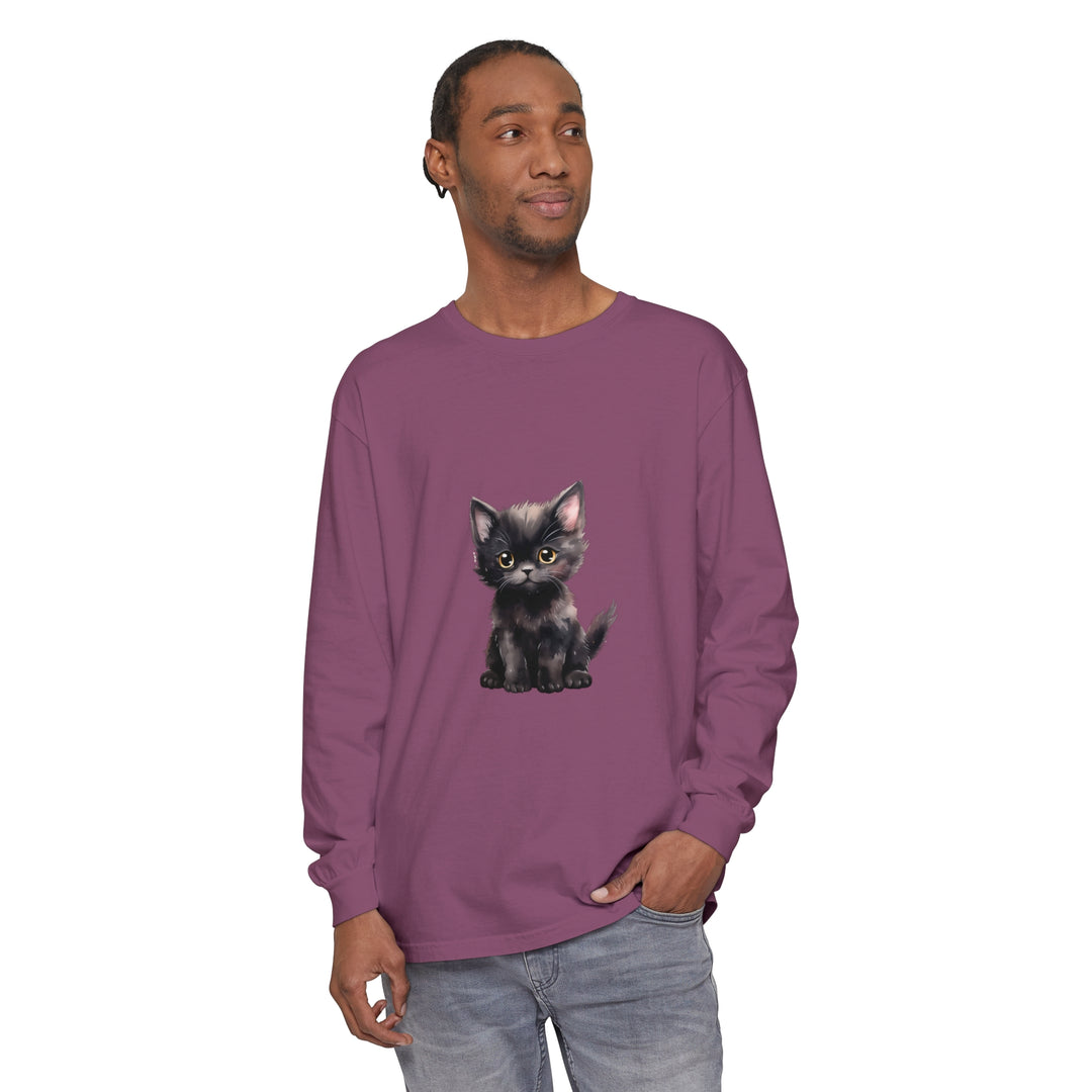 A cute black kitten with mesmerizing yellow eyes on a long sleeve t-shirt