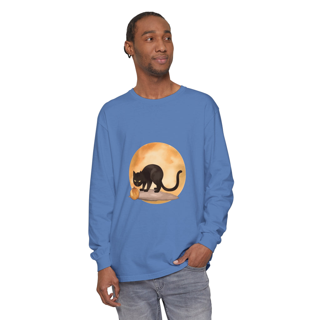 A spooky black cat with glowing eyes sits in front of a full moon on a Halloween themed t-shirt