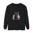 A close-up image of a black kitten watercolor splash t-shirt, featuring a playful and vibrant design with colorful splashes of watercolor in shades of blue, pink, and purple