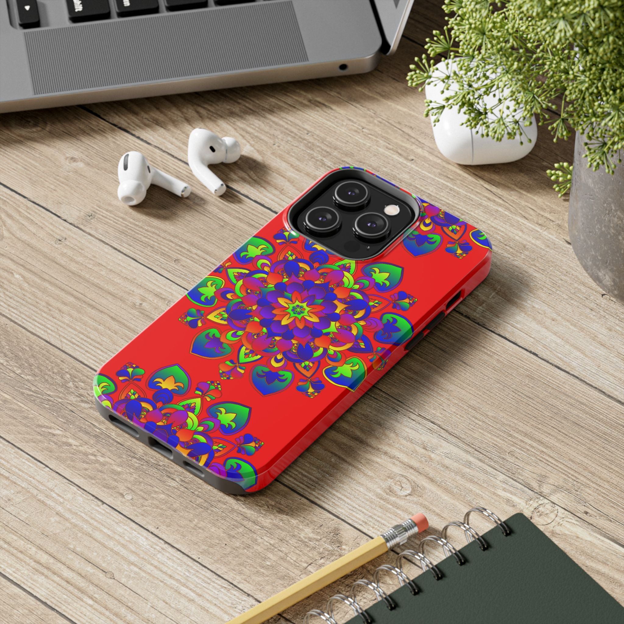 A beautiful and intricate hand-drawn red mandala art design on a phone case